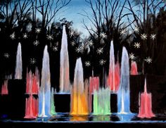 the colorful fountains are lit up in the night sky and snowflakes on the trees