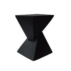 a black table that is on top of a white surface and it has a triangular shaped base