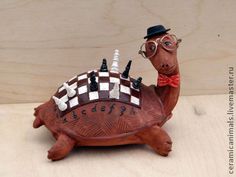 a turtle with chess pieces on it's back