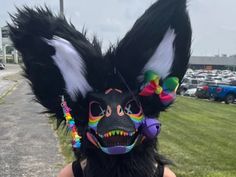 a person wearing an animal mask and sunglasses