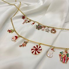 "Would you like to crown your style with our CHRISTMAS charms? Don't miss this special collection with 2 PİECES of each option! Order now and be ready for CHRISTMAS!" 💎 FOR PURCHASES OVER $49.99, RECEIVE A FREE JEWELRY BOX! 💎 Choose your favorite Charms. For example: N4 , 5 , 8 , 22 , 17 , 26 Caring for Your Jewelry  We want your cherished piece to remain as beautiful as the day you received it. To preserve the quality of your SAGU JEWELRY, please follow these tips:  Take off your jewelry befo Gold Necklace For Festive Christmas Occasion, Winter Jewelry, Ready For Christmas, Christmas Charms, Jewelry Cleaner, Nouvel An, Free Jewelry, Necklace Designs, Build Your Own