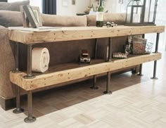 a living room filled with furniture and lots of wood planks on top of it