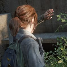 the last of us's female character is holding her hand out to another person