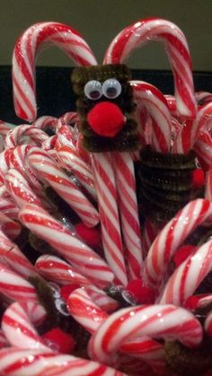 a bunch of candy canes with a reindeer face on top