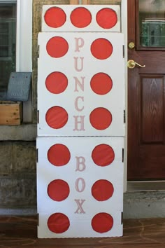 two cardboard boxes with red polka dots on them and the words punch box painted on them