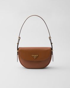 Cognac Prada Arqué Leather Shoulder Bag With Flap | PRADA Prada Arqué Leather Shoulder Bag, Minimalist Accessories, Designer Purses, Bag Details, Fancy Bags, Prada Bags, Classic Bags, Wallet Pouch, Saint Laurent Wallet