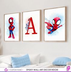 three spiderman wall art prints hanging on the wall in a child's bedroom