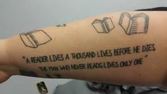 a person with a tattoo on their arm that says, a reader lives a thousand lives before he dies