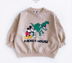 Get cozy in our Mickey Mouse Dinosaur sweatshirt made from French terry fabric. Perfect for chilly days, this sweatshirt is soft and comfortable, making it the perfect addition to your little one's wardrobe. Toddler Disney Outfit, Mickey Outfit, Dinosaur Sweatshirt, Disney Fits, Toddler Outerwear, Disney Sweatshirt, Disney With A Toddler, Baby Wishlist, Disney Sweatshirts