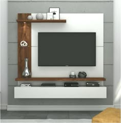 an entertainment center with a flat screen tv mounted on the wall