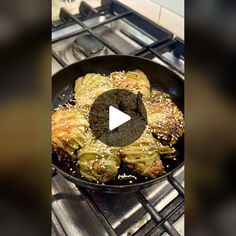 an image of food cooking in a pan on the stove