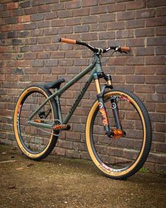 a bike leaning against a brick wall