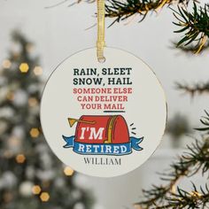 a christmas ornament hanging from a tree with the words rain, sleet, snow hail and someone else can deliver your mail