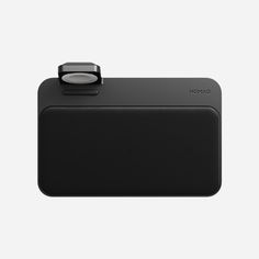 an image of a black camera on a white background with the lens facing up and to the side