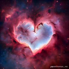 a heart shaped cloud in the middle of space