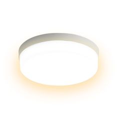 a round light that is on top of a white surface with an orange glow coming from it