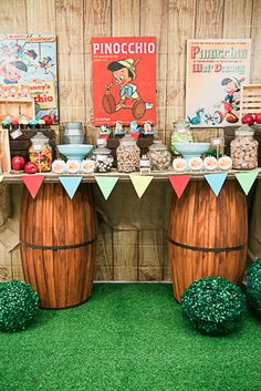 a table topped with lots of desserts and drinks on top of green carpeted flooring