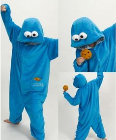 a child in blue pajamas with cookie monster on his chest and hands up to the side