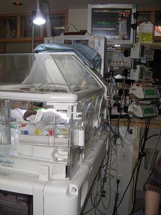 a hospital room filled with lots of medical equipment