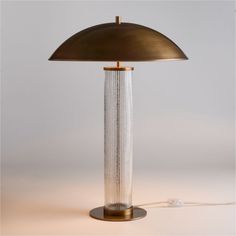 a lamp that is sitting on top of a table with a cord attached to it