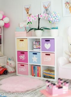 a child's room decorated in pastel colors with toys and decorations on the shelves