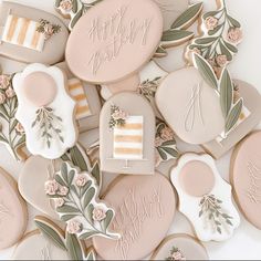 decorated cookies with the words happy birthday and flowers on them are arranged in a pile