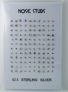 the nose studs are displayed on a white plastic package with black and silver lettering