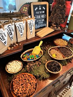 an assortment of nuts and other food items on display in a store window or shop