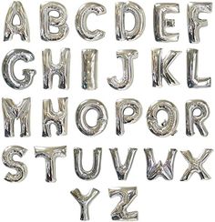 the letters and numbers made out of silver foil balloons are arranged in an alphabet pattern