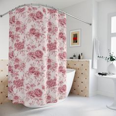 a bathroom with a bathtub, sink and shower curtain that has pink roses on it