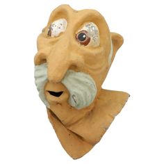 an old mask with large eyes and a mustache