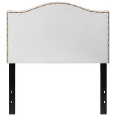 an upholstered headboard with beading and black wood legs, against a white background