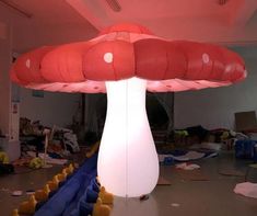 an inflatable mushroom sitting on top of a floor