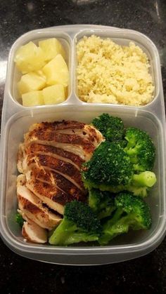 a plastic container filled with meat, broccoli and potatoes