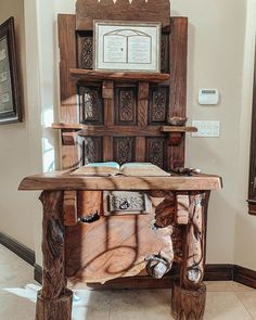 an old wooden desk with books on it