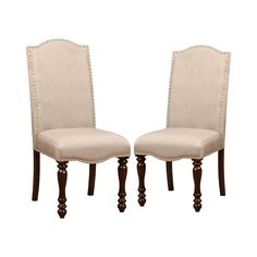 a pair of beige chairs sitting next to each other