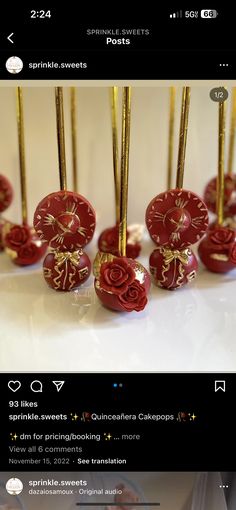 there are many red and gold ornaments on the table