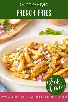 french fries with feta cheese and onions on a white plate