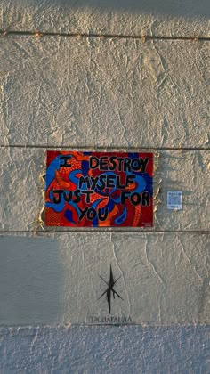 a sign on the side of a building that says destroy maybe it's for you