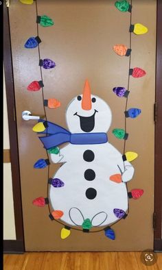 a door decorated to look like a snowman