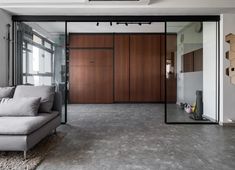 a living room with a couch and sliding glass doors