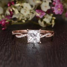 an engagement ring with a princess cut diamond