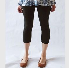 Womens cropped cotton leggings.  A wardrobe staple. They are perfect for wearing under tunics, skirts and dresses!  Made of soft 4 way stretch cotton lycra, these leggings have a 3.5" fold over high waist waistband, which you can wear up for tummy support or fold down to wear at your hip. The soft cotton lycra waistband allows for easy pull on style.  All seams are serged and reinforced at the crotch, and hemmed.  Cropped length hits about mid calf.  Inseam =  23.5" *Length can be lengthened or shortened as you'd like  (for reference I'm 5'5" modeling a size Medium) See Swatch Chart in the last photo for other Color options. Garments are Made To Order Please allow 7-10 days for your item to be sewn Below are my standard size measurements, which are simply a guideline, if you would like to Casual Stretch Capri Yoga Pants, Versatile Stretch Ankle-length Capris, Casual Stretch Capris For Yoga, Spring Ankle-length Non-stretch Yoga Pants, Stretch Casual Capris For Yoga, Fall Cropped Leg Capris With Elastic Waistband, Casual Spring Mid-calf Bottoms, Spring Cotton Leggings With Elastic Waistband, Versatile Spring Yoga Pants