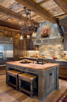 a rustic kitchen with an island in the middle