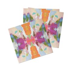 two square coasters with colorful flowers on them