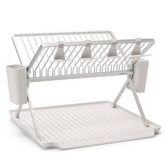 a white rack with three cups on it