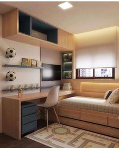 a bedroom with a bed, desk and television in it's corner area next to a window