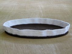 a close up of a white and black object on a carpeted floor with no one around it