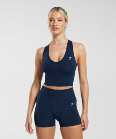 ADD A LITTLE EXTRA These collections take your training staples and give you something a little bit extra. • Seamless cropped tank SIZE & FIT• Cropped fit• Model is 5'8" and wears size XS MATERIALS & CARE• 88% Nylon, 12% Elastane SKU: B7A3H-UB9P Workout Clothes Outfits Gym, Blue Leggings Outfit, Gymshark Outfit, Workout Sets Outfit, Unrealistic Wishlist, Gymwear Outfits, Cute Gym Outfits, Gym Fits, Workout Sets