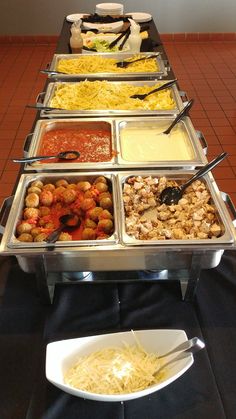 a buffet line with different types of food